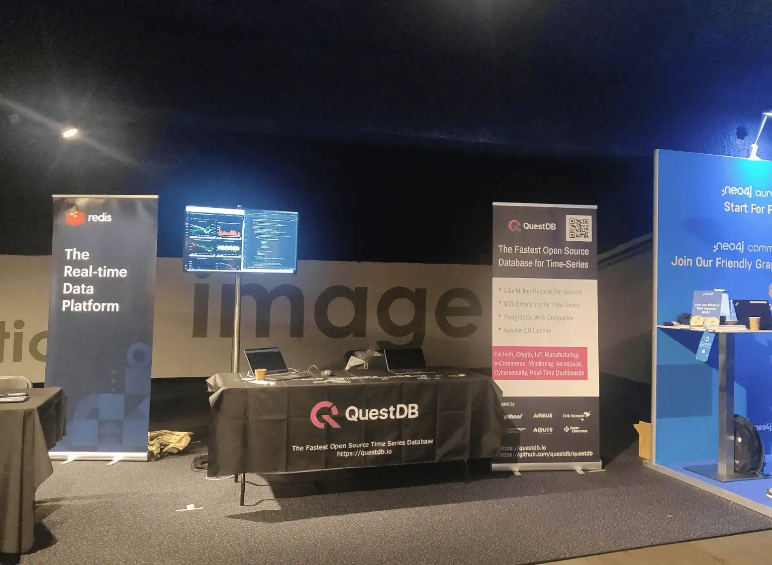 Photo showing the QeusteDB booth is set to go