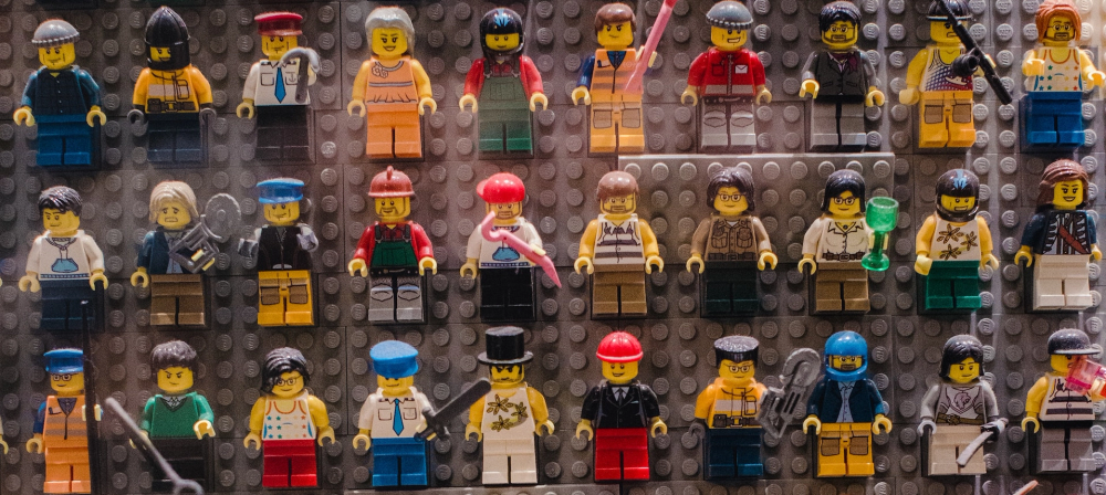 Three rows of ten diverse lego people - their colourful outfits demonstrate various roles and jobs, and a radical amount of personality.