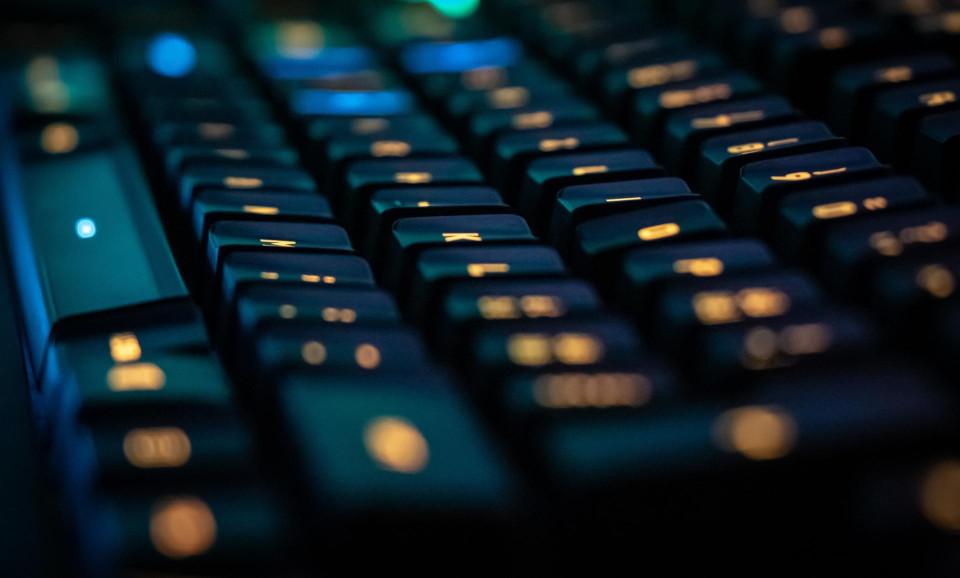 Close-up on a dark computer keyboard.