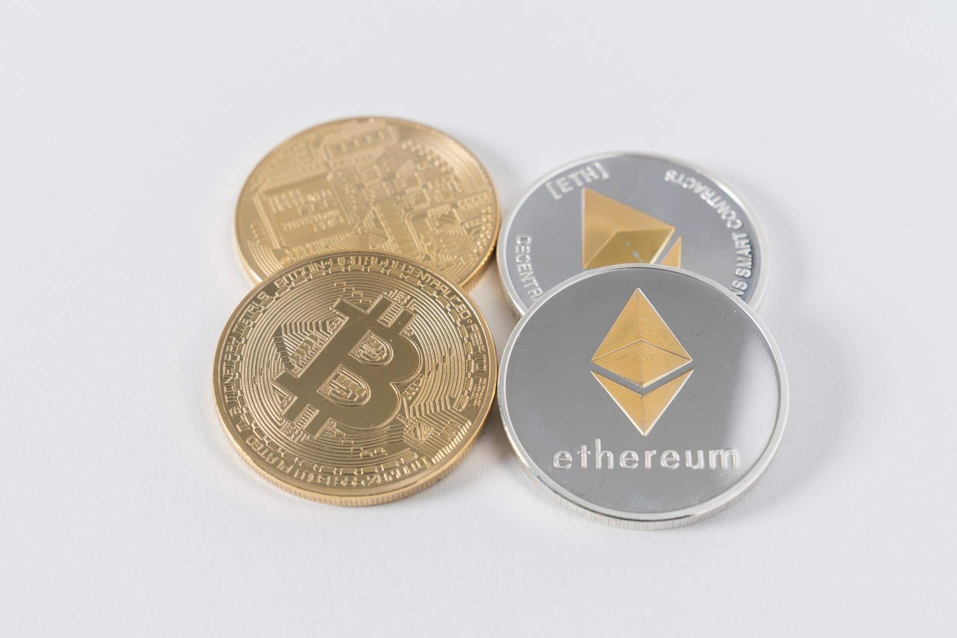 Physical coins with Ethereum and Bitcoin logos.