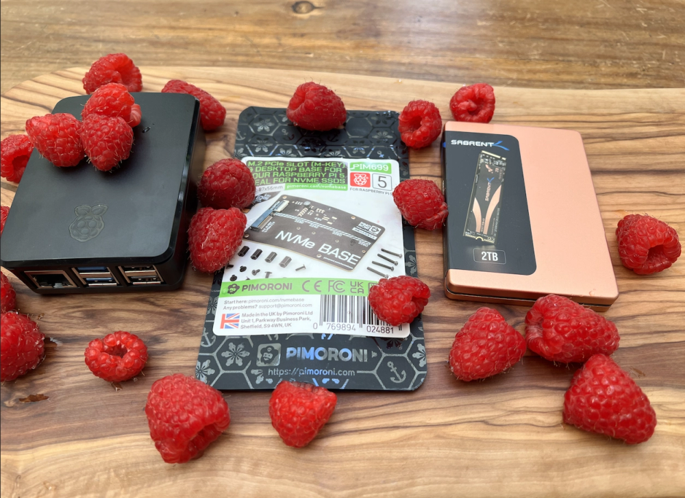 A Pi 5, its case, and the NVMe extension. Covered in Raspberryes! Yes, real ones. The fruit. On a nice wooden slab. My good friend Oleksiy made it. He's a great guy.